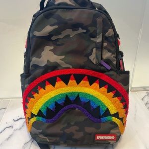 SPRAYGROUND backpack camo with chenille rainbow shark with gentle wear